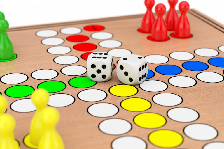 Family Ludo Desk Wooden Board Game Closeup on a white background. 3d Rendering